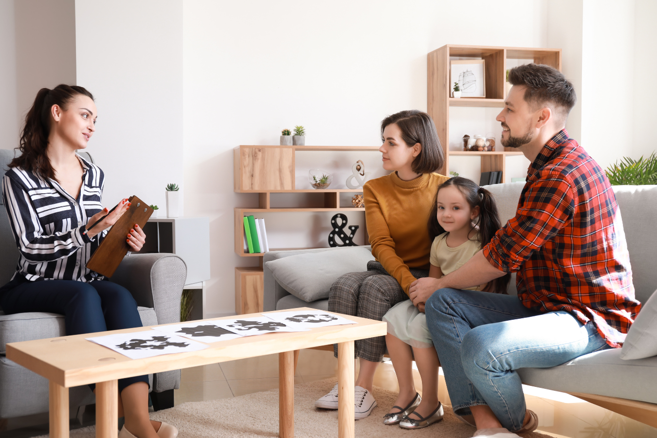A photo of a counsellor and a family with a Mother, a Father, and a young, school aged daughter. ERPs can help Family Services organizations maximize their care for their clients.