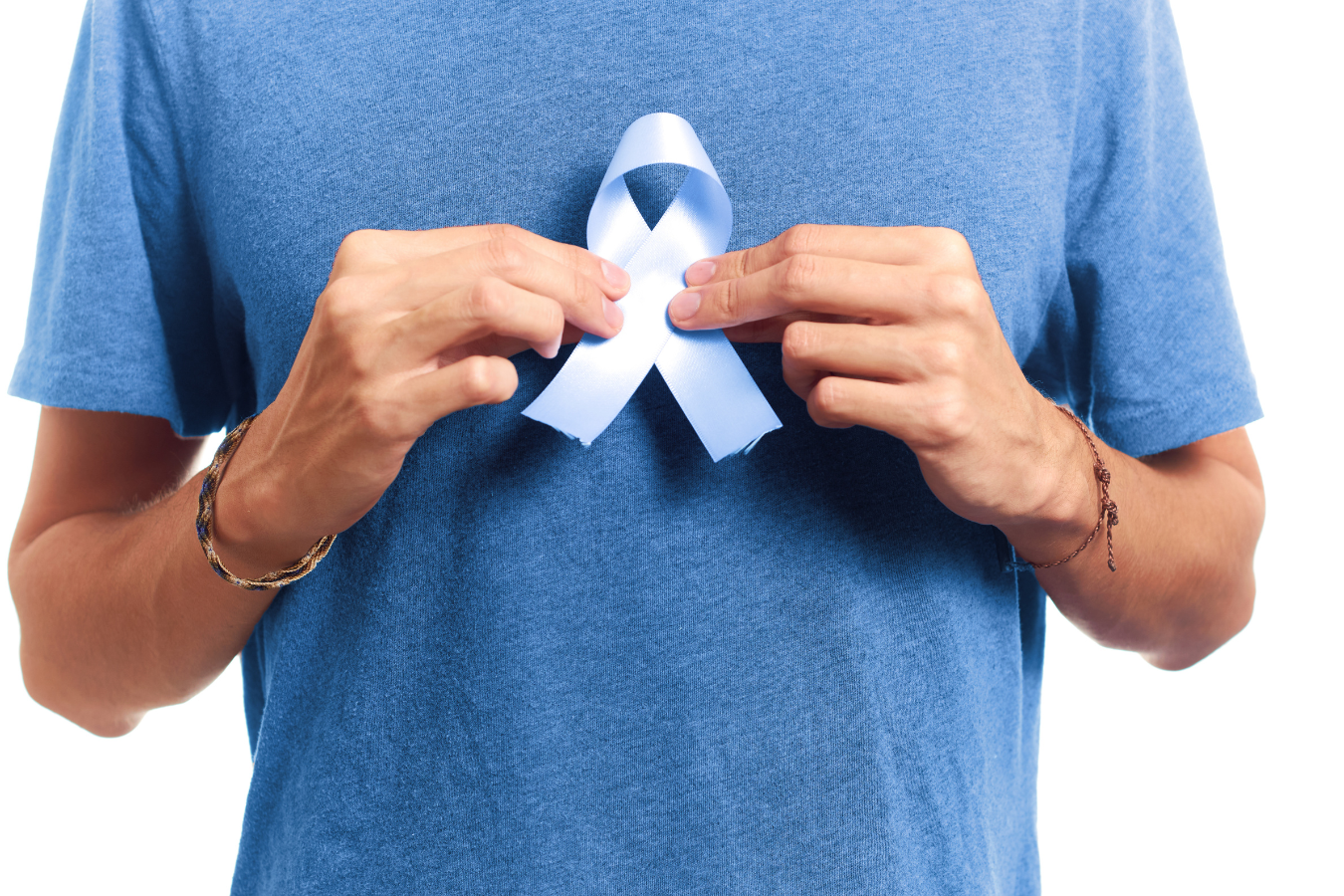 A man proudly holding a blue ribbon for health research charity. Sparkrock 365 ERP aids health charities, enhancing efficiency and dedicating more time and resources to critical research initiatives.
