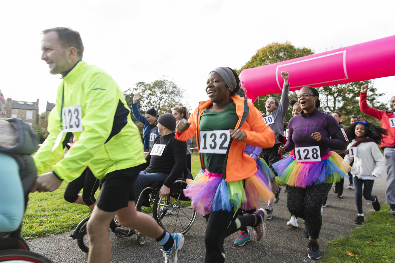 Participants in costumes joyfully completing a charity run. Sparkrock 365 ERP supports charity events, optimizing efficiency for smoother organization and better resource allocation through technology.