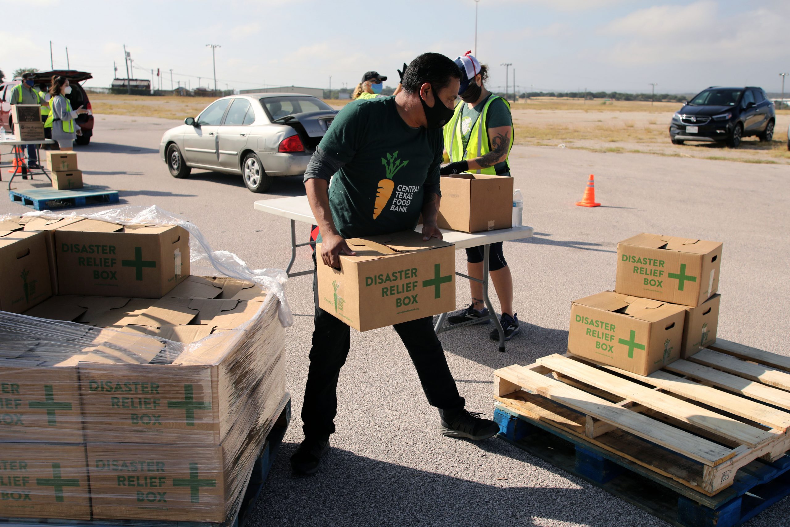 A disaster relief volunteer offering crucial aid. Sparkrock 365 ERP enables efficient disaster response, ensuring organizations have more time and resources to address urgent needs through advanced technology.