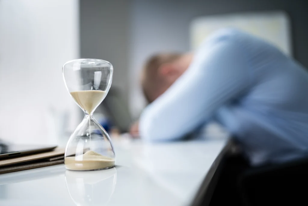 Hourglass on a desk symbolizing time running out to plan a Great Plains migration before vendor capacity tightens.